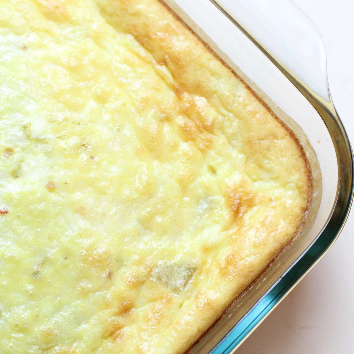 A slightly golden brown topped egg casserole after it has been removed from the oven to cool.