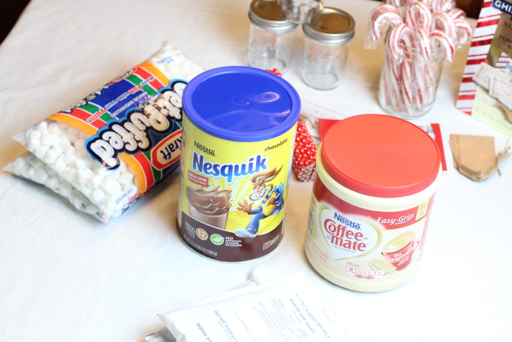 Store bought ingredients for hot cocoa mix in mason jars.