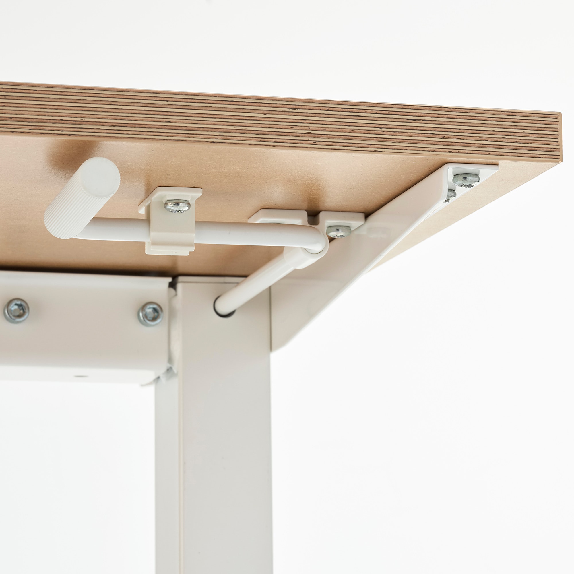 The handle on the adjustable height table snapped into a clip on the under side of the table when not in use. 