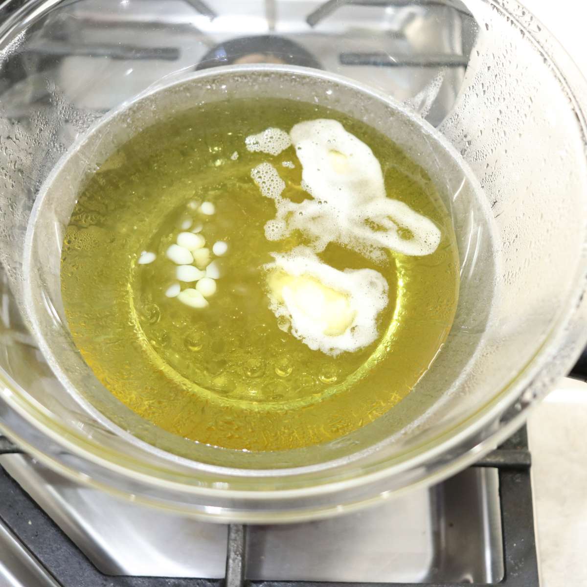 Homemade sunscreen ingredients in a double broiler after 7 minutes. A nice yellow liquid is ready to be used for the recipe. 